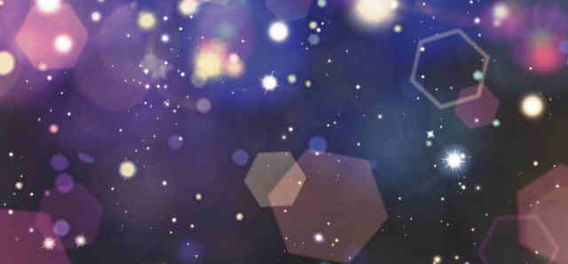 暗い背景に光がきらめく画像